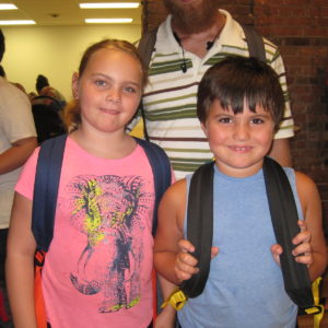 Two children with backpacks at the Backpacked for Success event